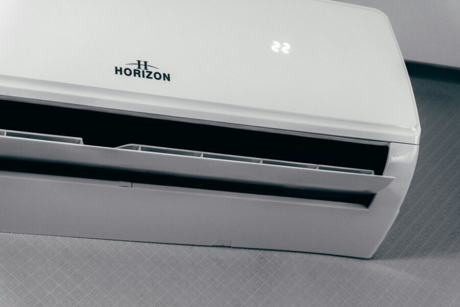 White air conditioner unit displaying 22 degrees